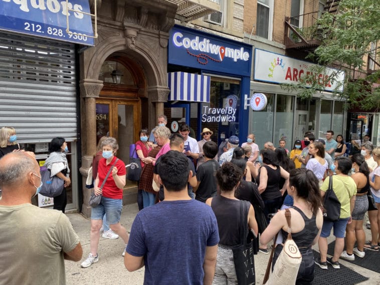 Crowds pack the sidewalk for Coddiwomple's grand opening/Upper East Site