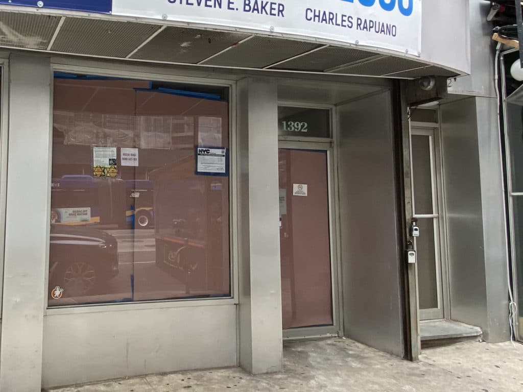 Vacant storefront where anti-Semitic anti-vaccination flier is posted