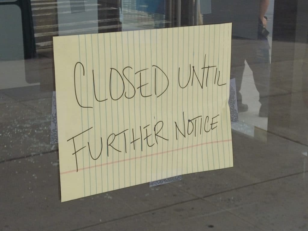 Closed sign posted on AT&T store door/Upper East Site