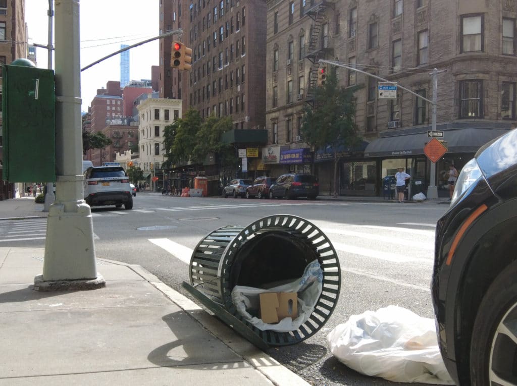 Trash tossed into the street by homeless man/Upper East Site