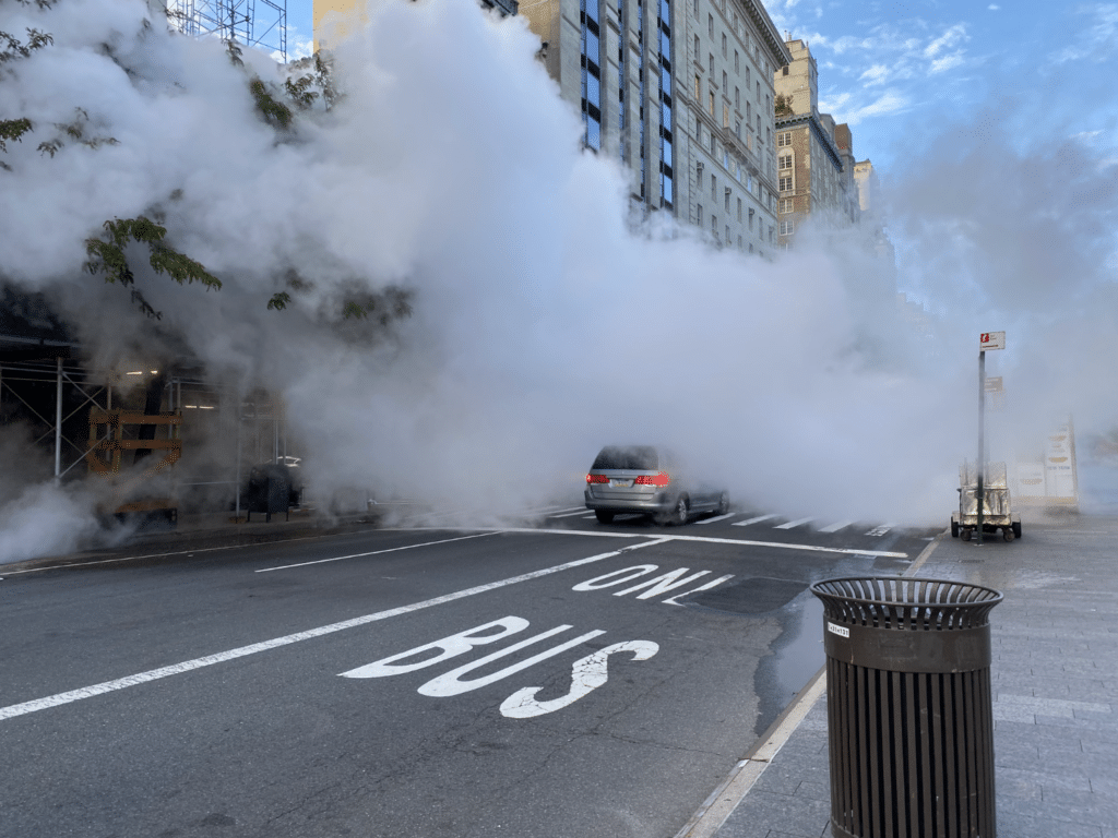 Minivan creeps through wall of team clouds on Fifth Avenue/Upper East Site