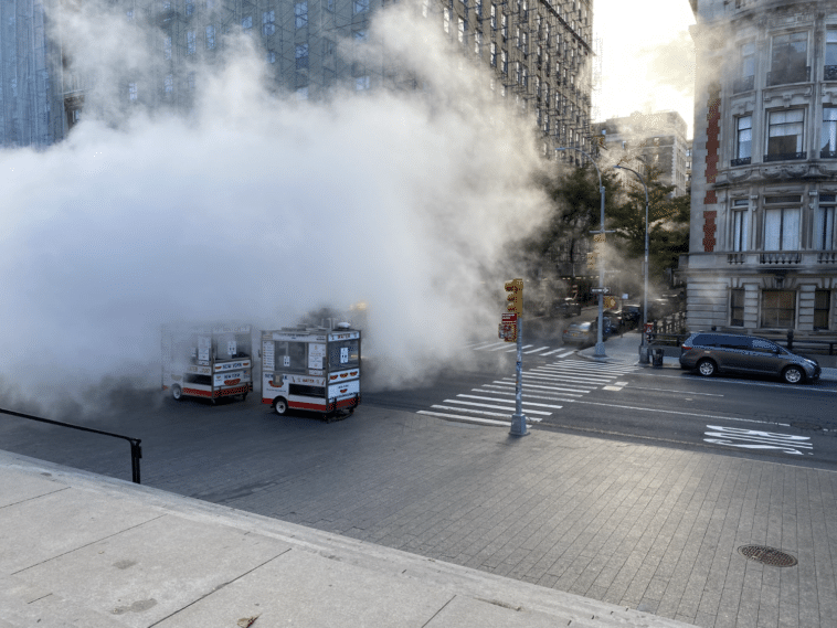 Barely visible MTA Bus drives through wall of team clouds on Fifth Avenue/Upper East Site
