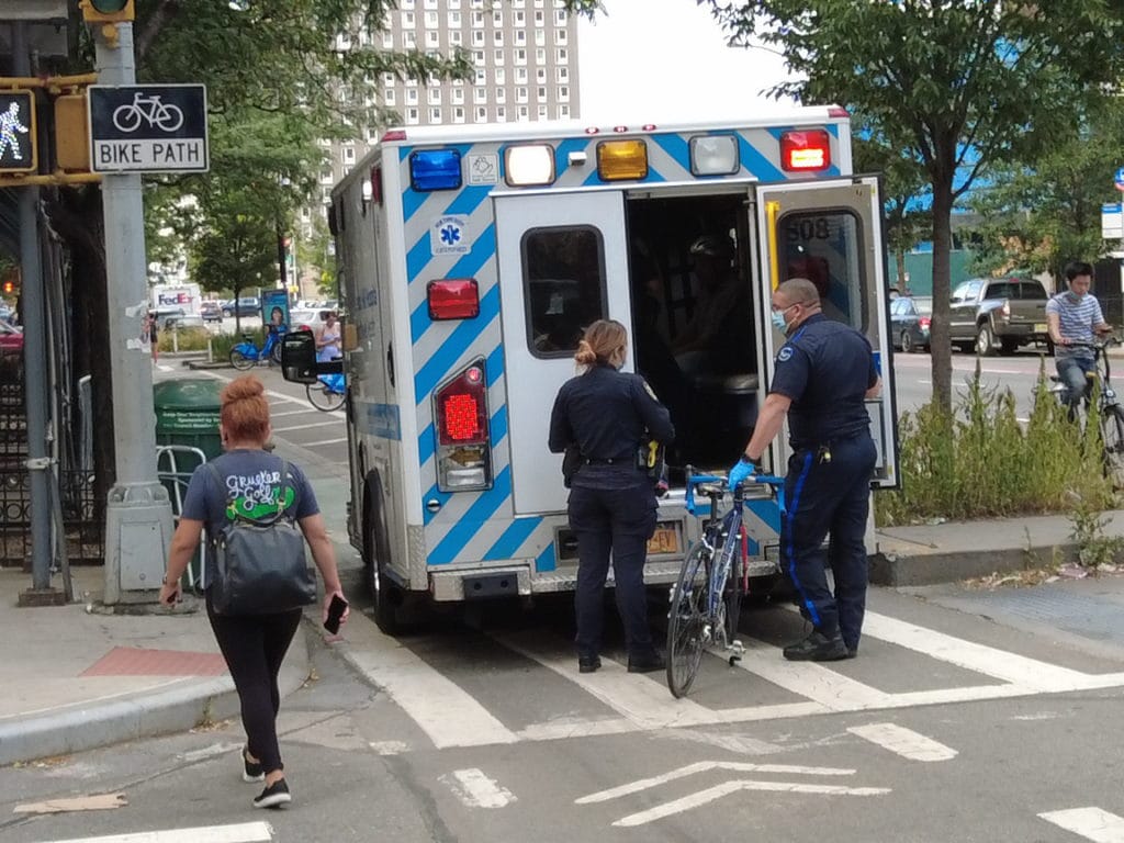 Elderly cyclist sits in ambulance after hit-and-run crash/Upper East Site