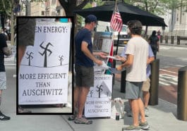 Conspiracy theorists chat with passers-by as swastika poster hangs nearby/Lance Yasinsky
