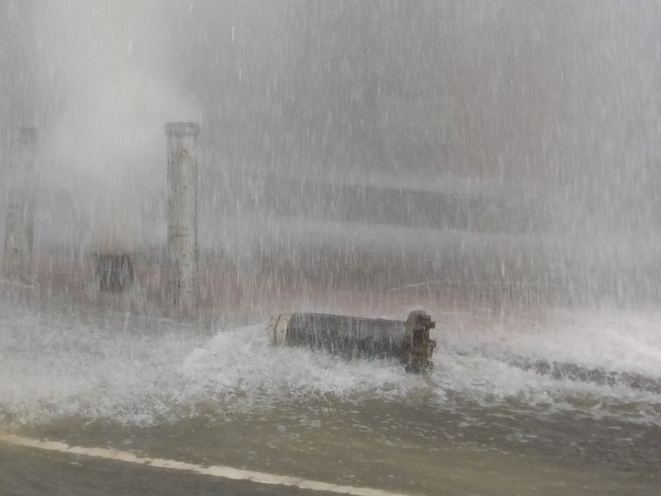 Broken fire hydrant lays in the street as water blasts into the air/SpotNews.tv for Upper East Site