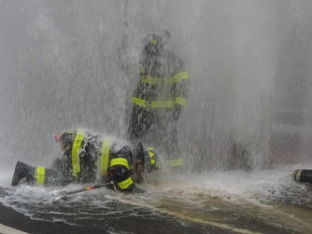 Firefighters work to turn off water to broken hydrant/SpotNews.tv for Upper East Site