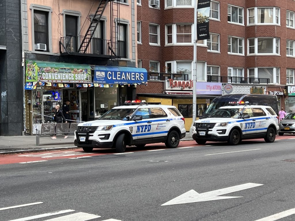 Police officers investigate knifepoint robbery at UES deli/Upper East Site