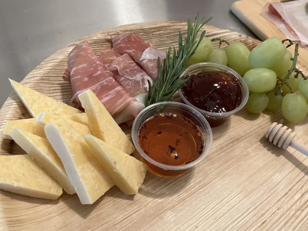 Krewe de Fromage's charcuterie boards include cheese, meats, fruit and homemade jalapeño honey/Upper East Site