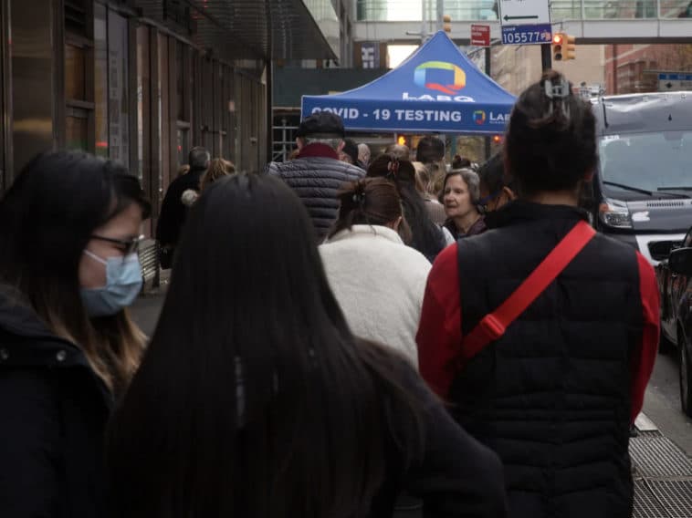 People wait in line for a rapid COVID test outside Hunter College on the Upper East Side, Dec. 16, 2021/Ben Fractenberg, THE CITY