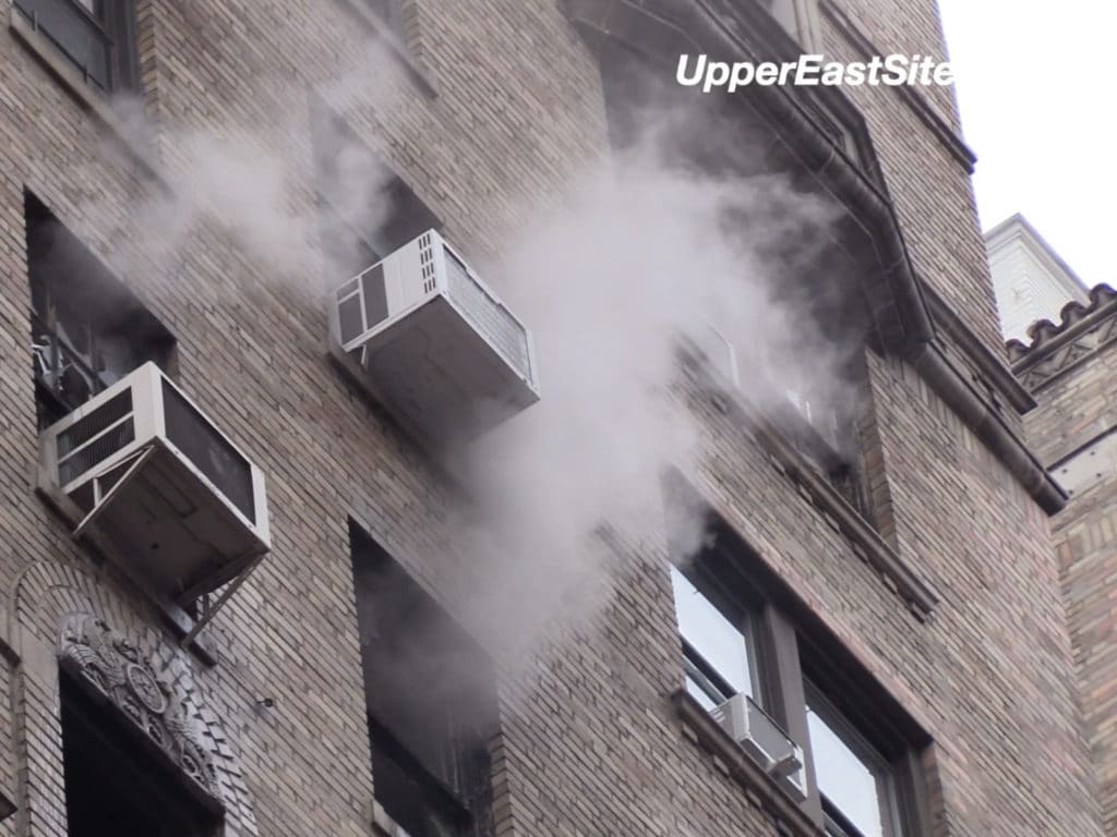 Smoke pours from the building's windows as FDNY crews fought the fire/Upper East Site
