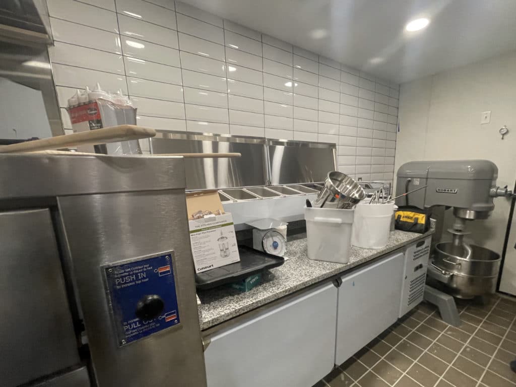 Dough mixer and pizza station inside Heavenly Market's new location