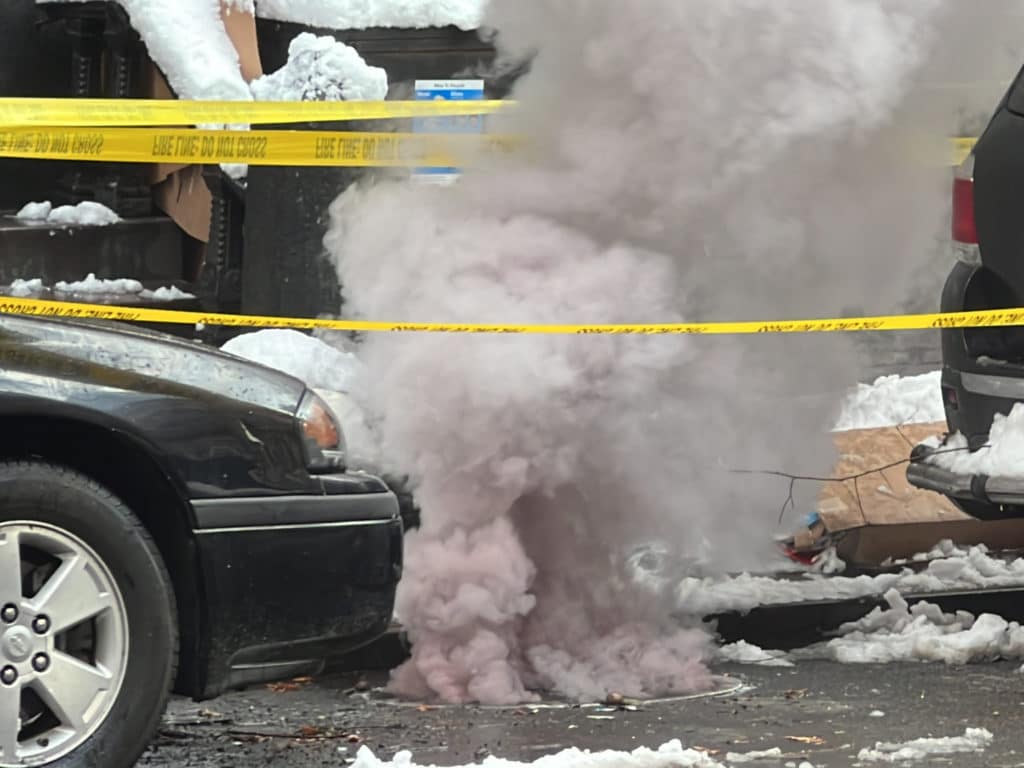 Smoke billows from between cars on East 92nd Street/Upper East Site