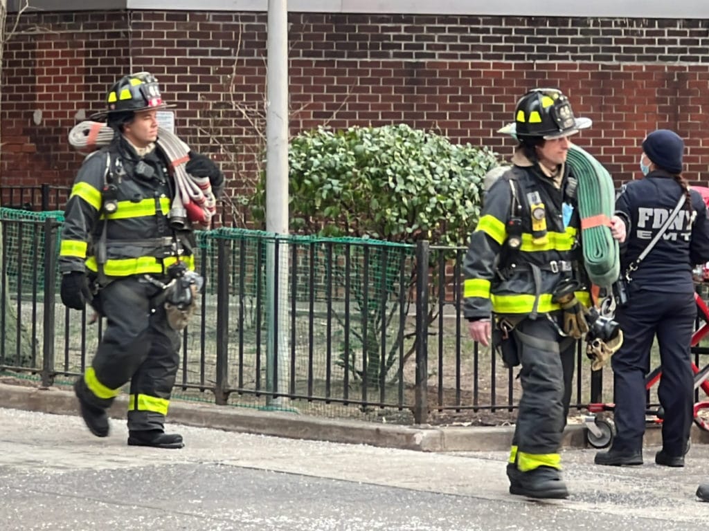 Firefighters leave the NYCHA building on First Avenue/Upper East Site