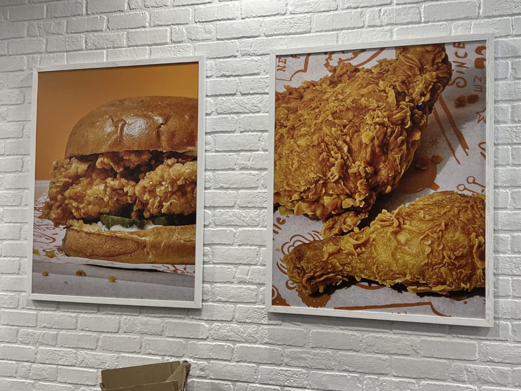 Fried chicken and chicken sandwiches decorate the walls inside Popeyes/Upper East Site