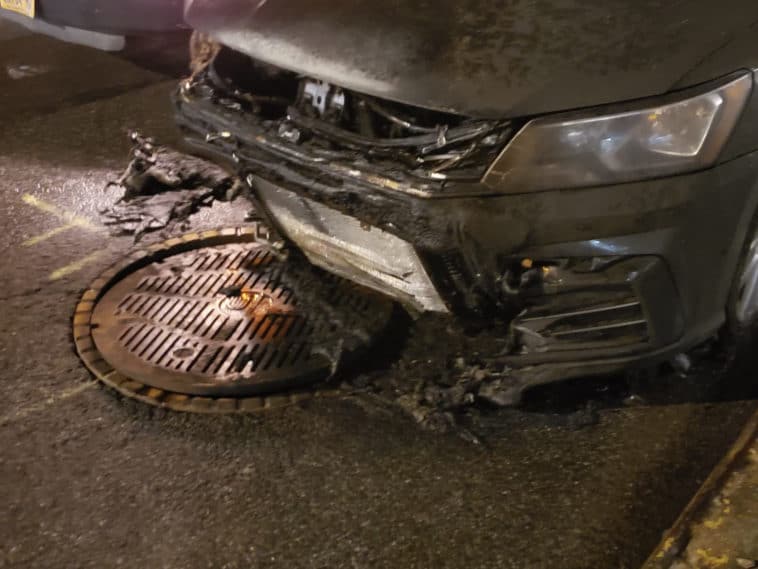 A car became engulfed in flames after a manhole exploded in Manhattan on February 4, 2022/Andrew Fine