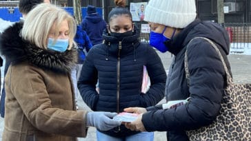 Congresswoman Carolyn Maloney hands out kits with N95s and Covid rapid tests at the Isaac's Center/Upper East Site