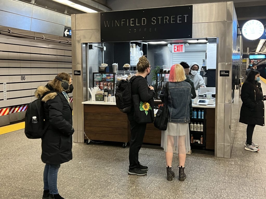 Customers waiting to order at Winfield Street Coffee inside the East 86th Street-Second Avenue subway station/Upper East Site