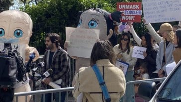 Anti-maskers in baby costumes protest outside Gracie Mansion