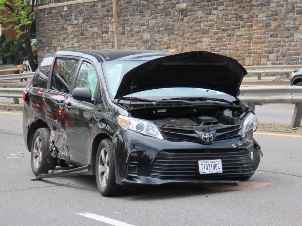 A black minivan had to be towed from crash scene/Upper East Site