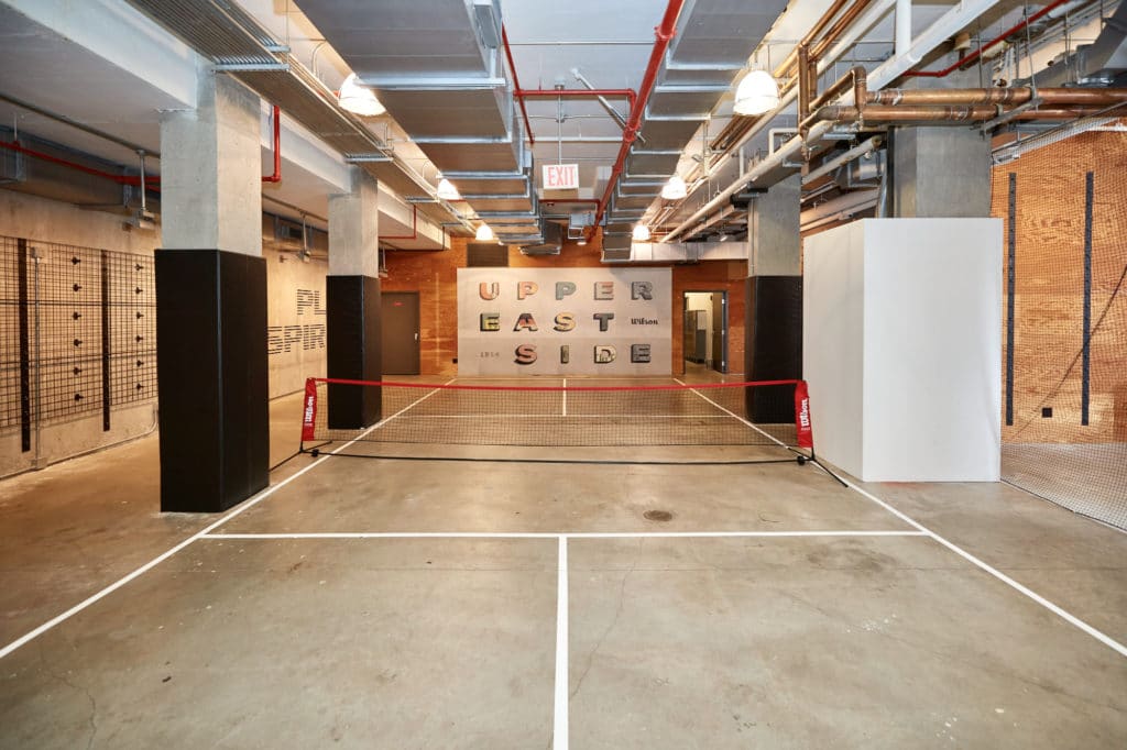 On the store's lower level is a multi-use court to try out products and an Upper East Side mural | Wilson Sporting Goods