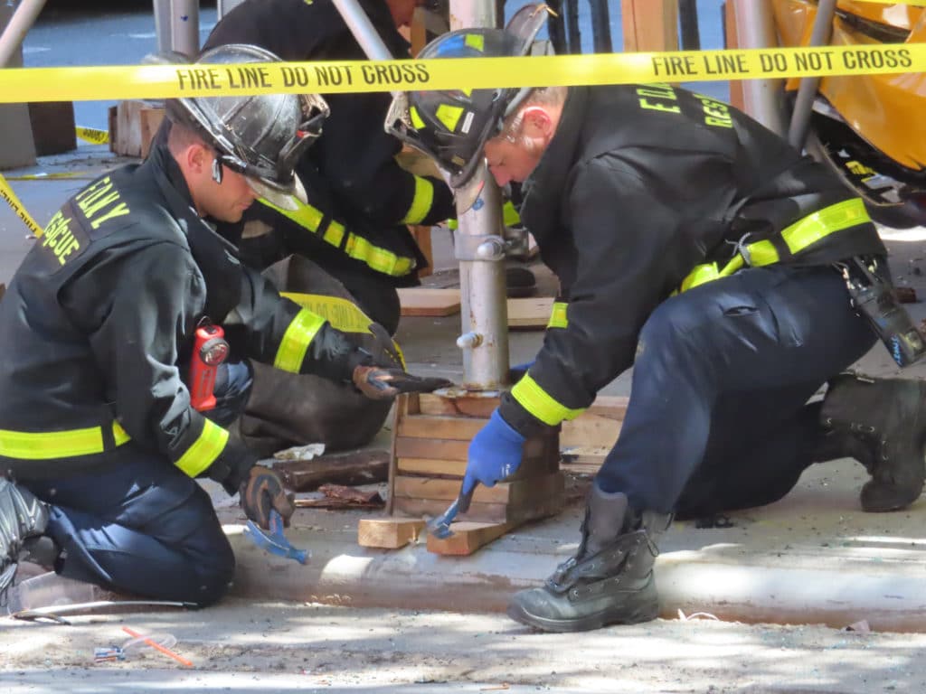 Firefighters worked to secure the unstable structure after the crash | Upper East Site