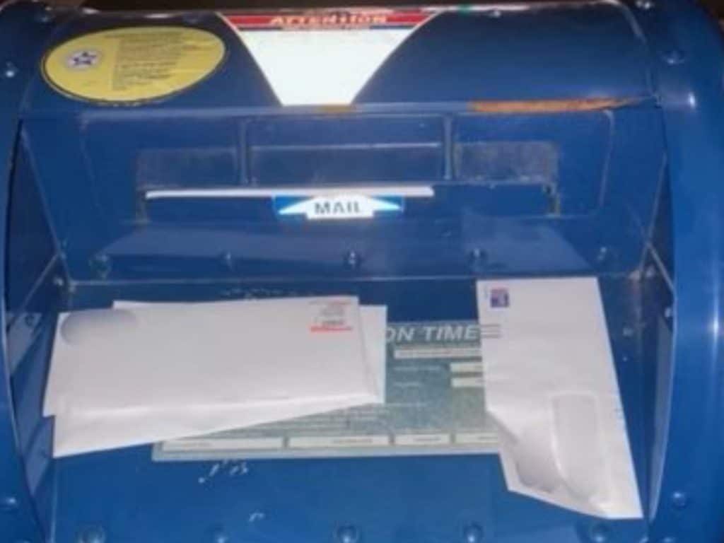 Stolen mail can be seen outside of the mailbox | NYPD