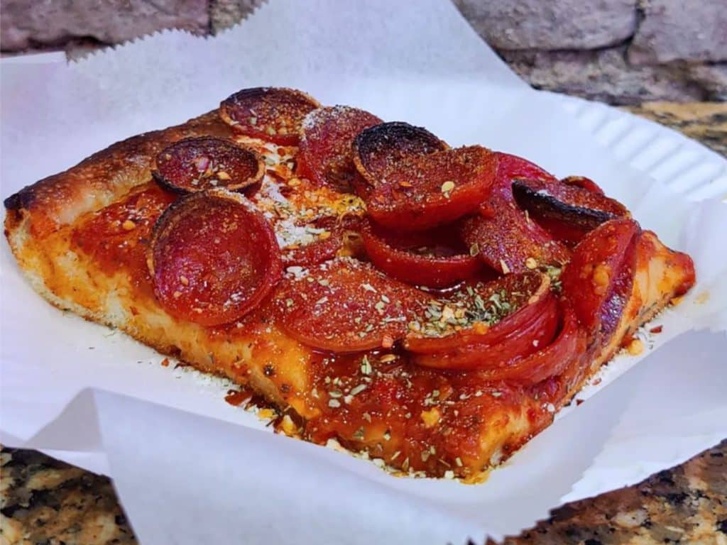 Village Square Pizza is known for their Pepperoni Square piled high with pepperoni