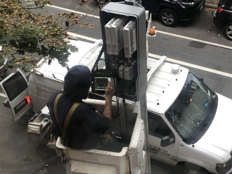 Workers were seen installing the 5G transmission equipment on October 1st