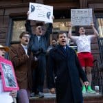State Senator Brad Hoylman and tenants stood on the stoop of 336 West 17th Street while holding placards against building owners “ghosting” them