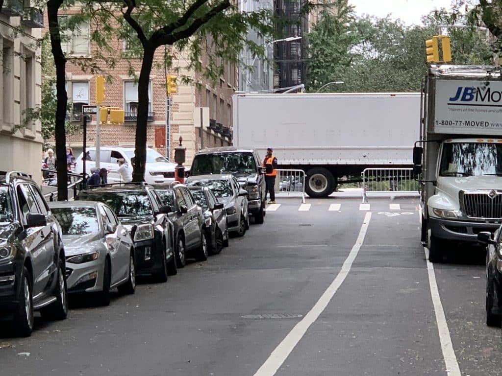 An illegally parked truck and barriers block the bike lane and entryway to authorized vehicles | Dr. Pamela Lipkin