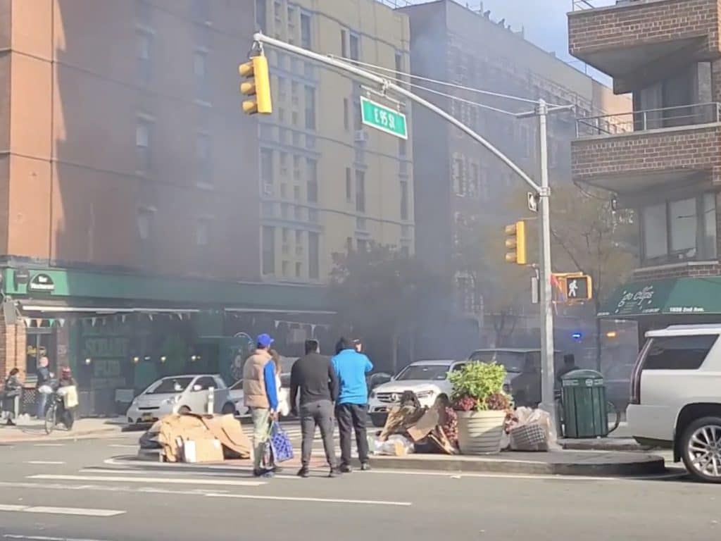 Piles of the man's cardboard can be seen on the Second Avenue median after the fire
