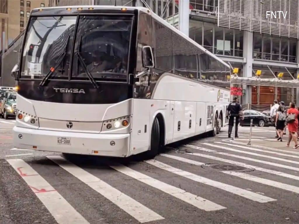 A bus full of migrants sent from Texas arrives at the Port Authority Bus Terminal in August