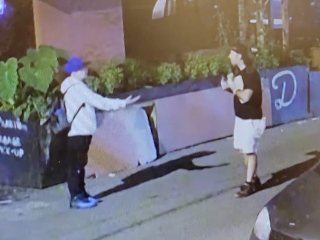 Good Samaritan (left) pleads with vandalism suspect (right) to stop the destruction | Chabad Israel Center