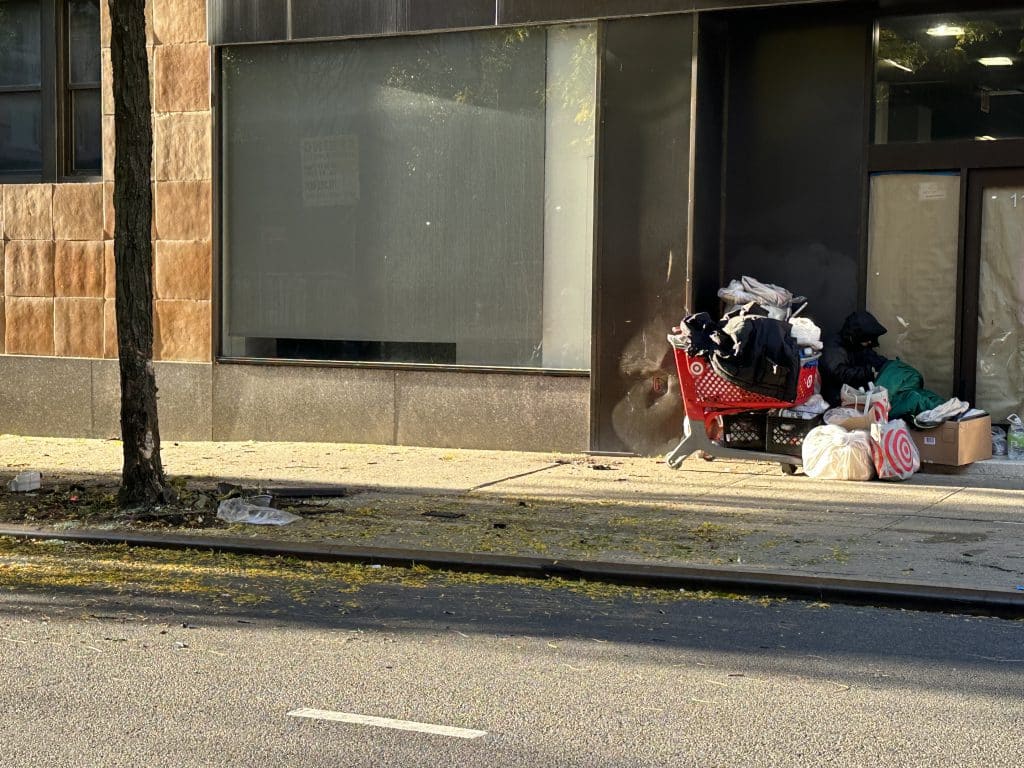 A homeless man sleeps on an Upper East Side sidewalk | Upper East Site