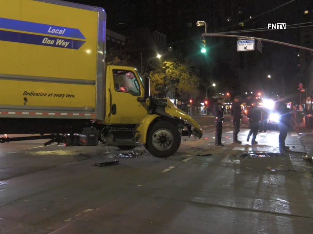 The front end of the yellow Penske truck was smashed in the collision