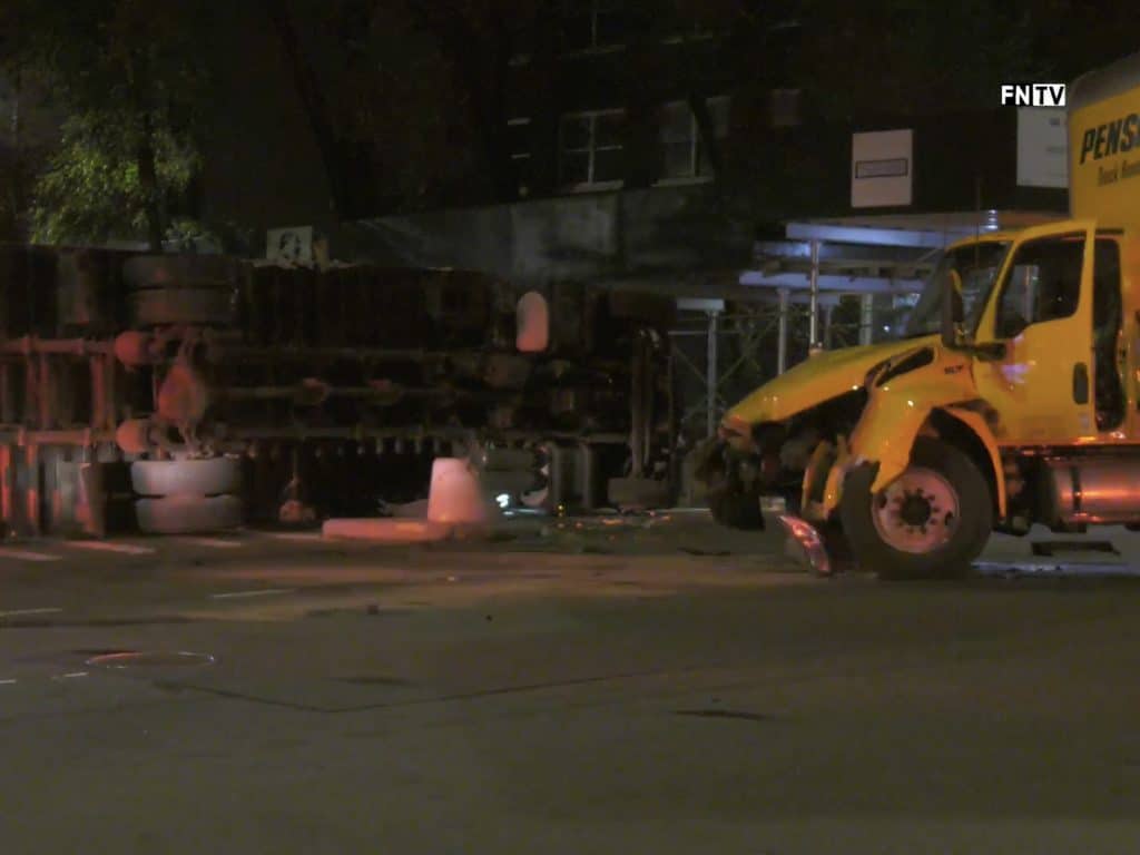 The flipped truck blocked East 86th Street for several hours