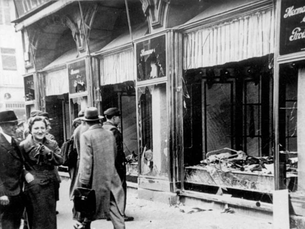 Damaged storefronts line the street in Magdeburg, Germany after the antisemitic attacks of the Kristallnacht 