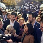 Gov. Kathy Hochul shakes a dog's paw as she campaigns on the Upper East Side