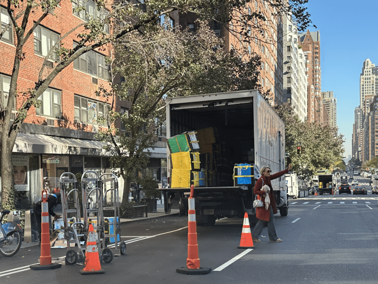 Double Parked Amazon truck sits next to unused open parking spaces on Third Avenue | Upper East Site