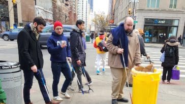 NYS Assembly Member-elect Alex Bores helps clean up East 86th Street with UES volunteers