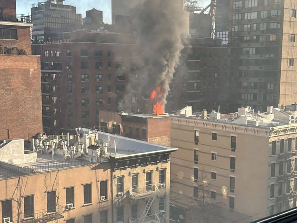 Flames were seen erupting from the roof of the Upper East Side building
