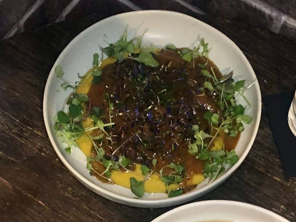 The Mushroom Ragout over saffron and lentil puree is a vegan dish