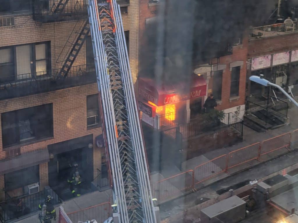 Intense flames shoot from the uniform shop located at 404 East 63rd Street | Upper East Site
