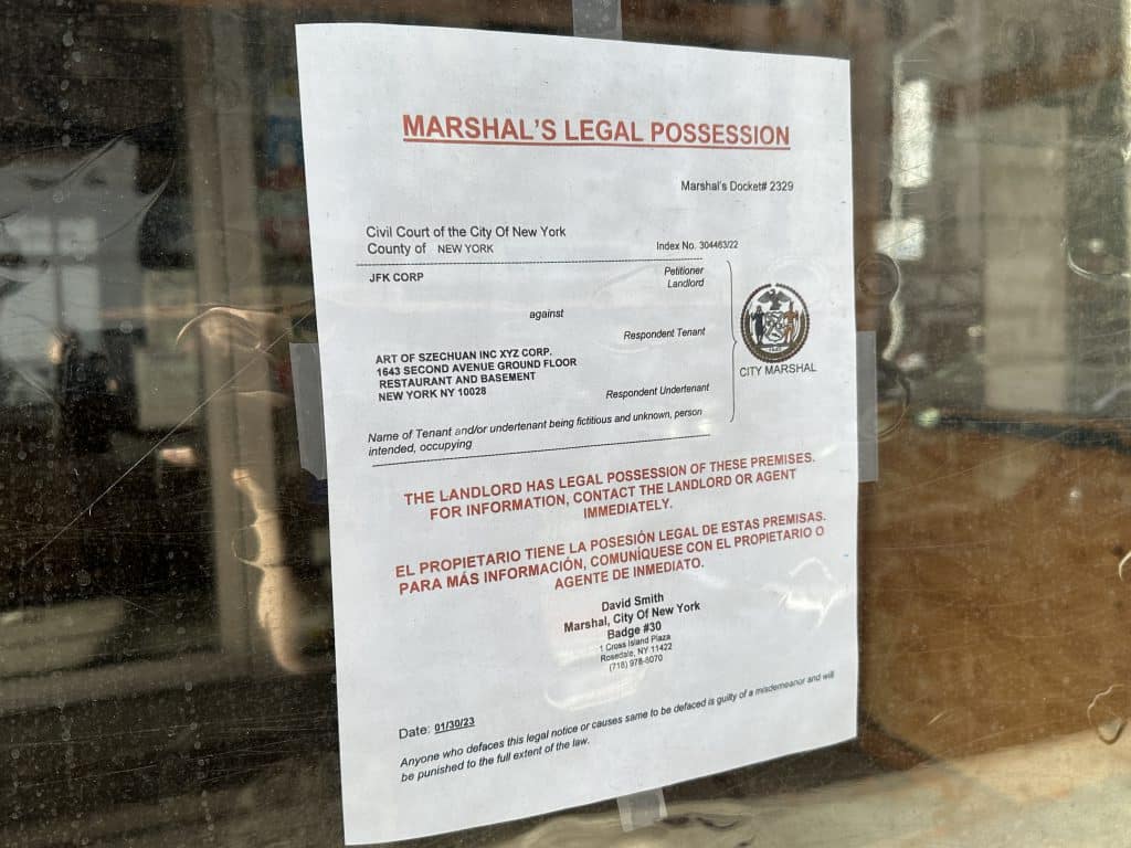 A notice on the window of China Jade reads 'Marshal's Legal Possession' | Upper East Site
