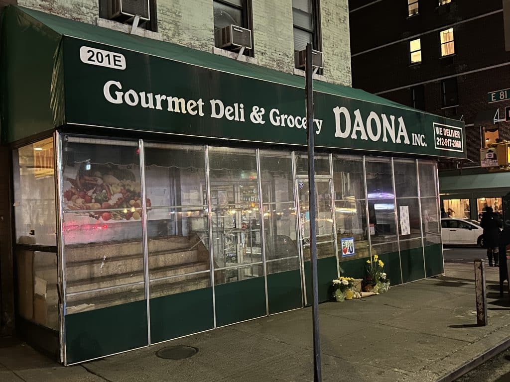A makeshift memorial for the slain worker sits in front of Daona deli | Upper East Site
