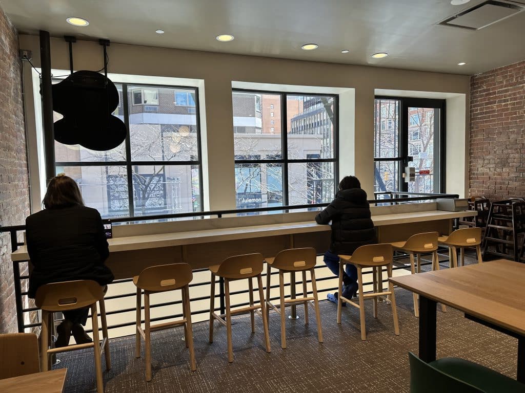 Bar seating on the second floor of Panera Bread looks out on Third Avenue | Upper East Site