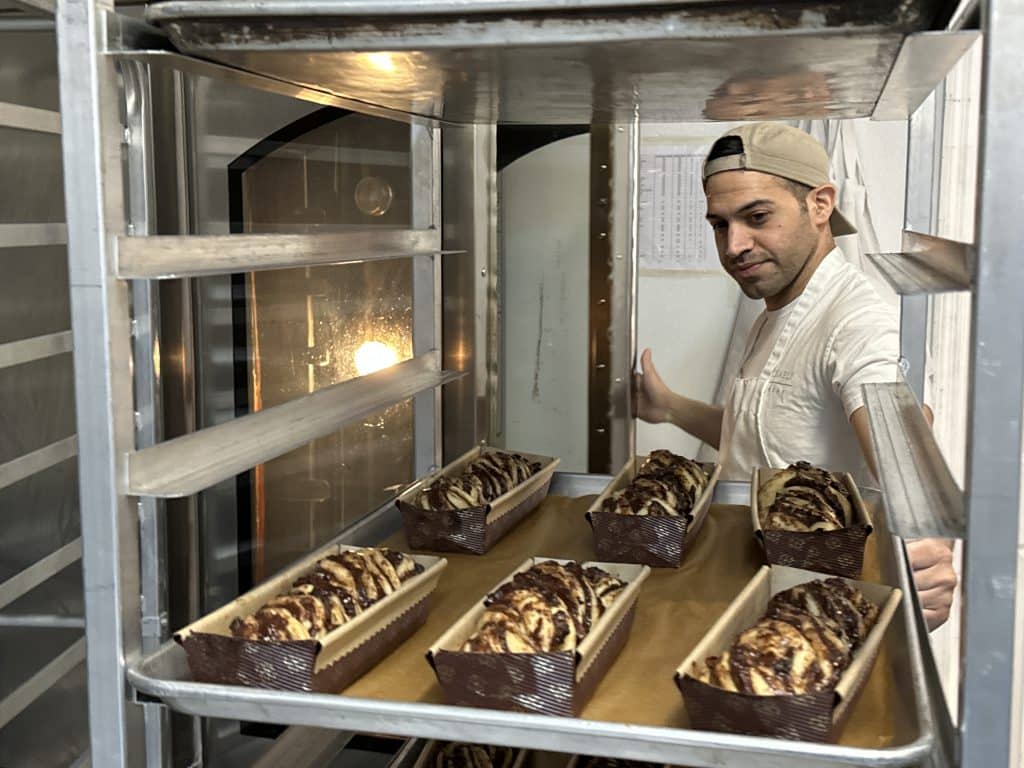 Chef Adir Michaeli loads babkas into the oven at his Upper East Side bakery | Upper East Site