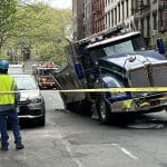 Sinkhole swallows part of giant dump truck on Upper East Side street | Upper East Site