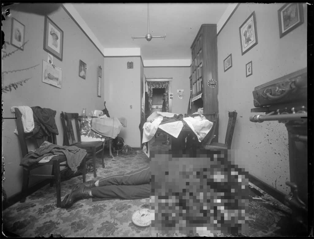Crime scene photo shows Patrolman John P. Flood dead on the floor of Mannix's UES apartment | NYC Municipal Archives