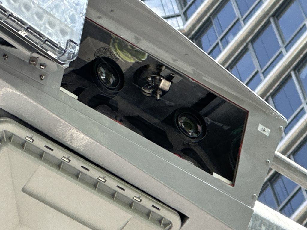 A close up photo shows the tolling equipment contains four cameras to read license plates, two in each direction, and E-ZPass scanners